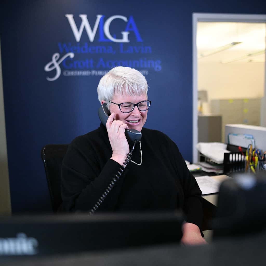 WLGA office manager on the phone